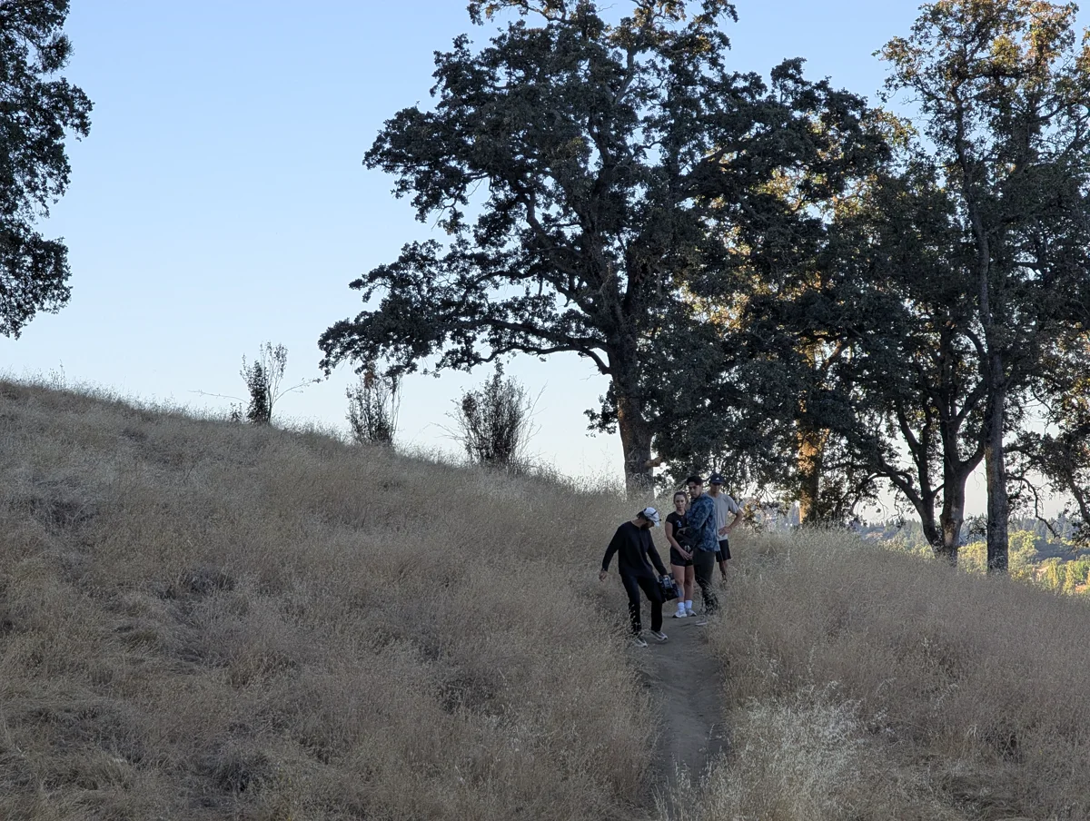 Behind the scenes: crew working at an outdoor filming location